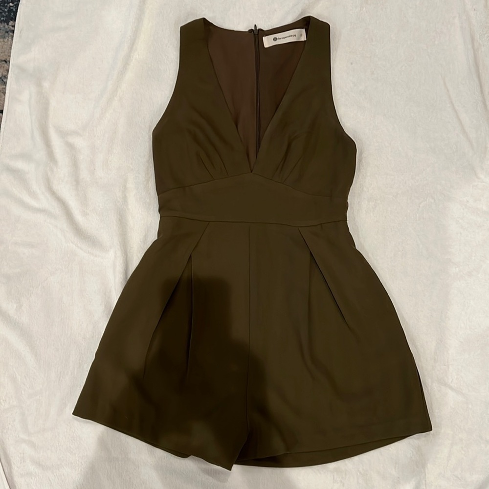 Army green romper with side pockets.